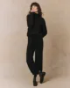 The Cashmere Turtleneck Sweater. -- Black sold by THE GREAT.