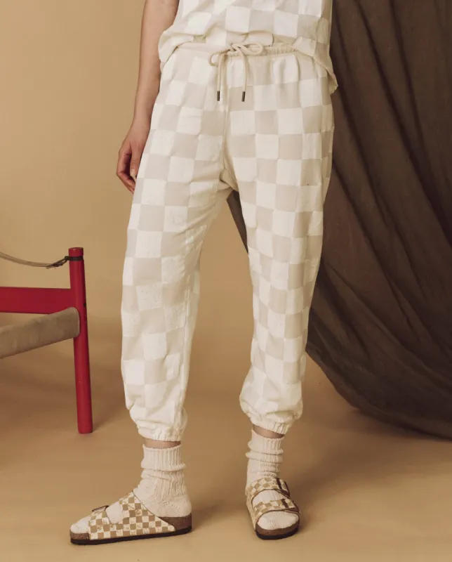 The Hand Stamped Stadium Sweatpant. -- Washed White with White Check sold by THE GREAT.
