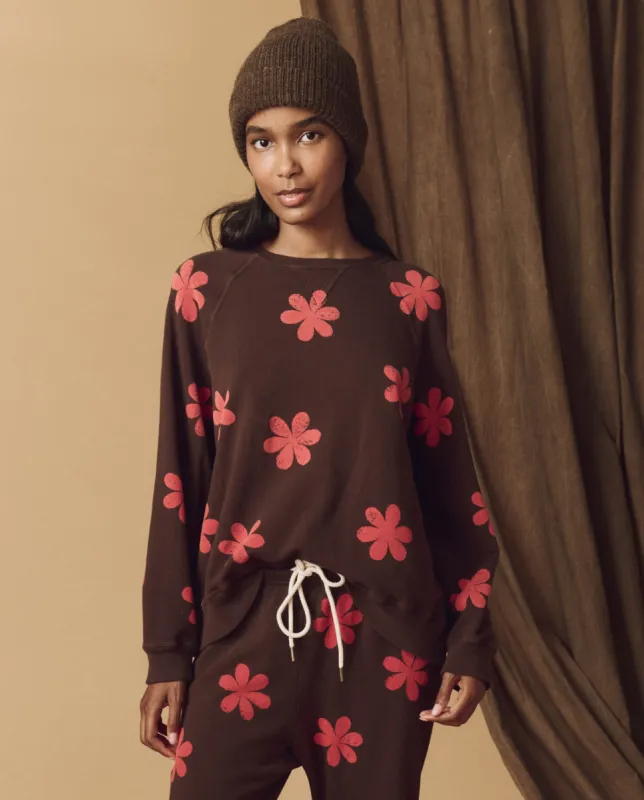 The Hand Stamped Slouch Sweatshirt. -- Mocha with Hot Red Daisy sold by THE GREAT.
