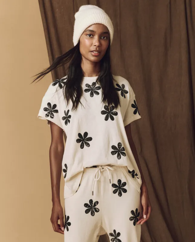 The Hand Stamped Boxy Crew. -- Washed White with Black Daisy sold by THE GREAT.