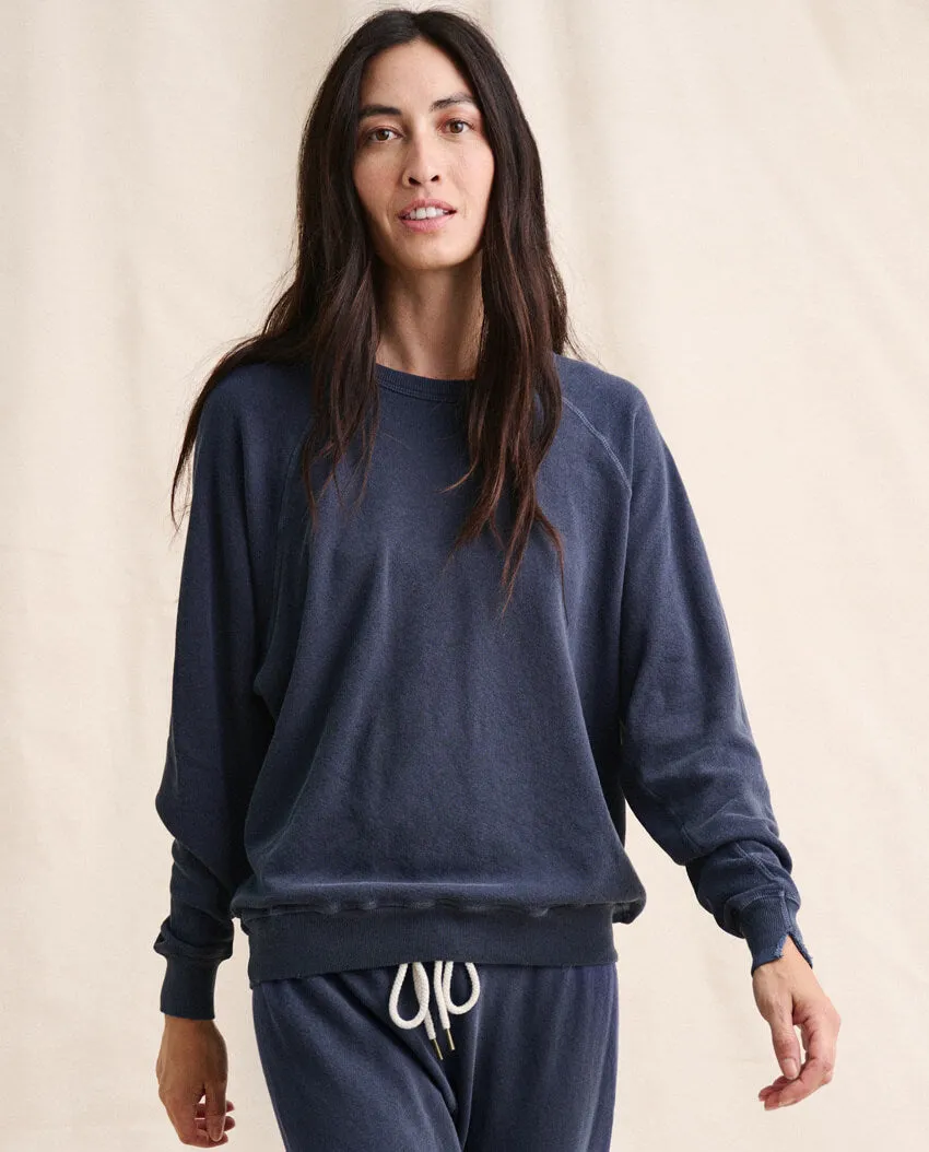 The College Sweatshirt. Solid -- WASHED NAVY sold by THE GREAT.