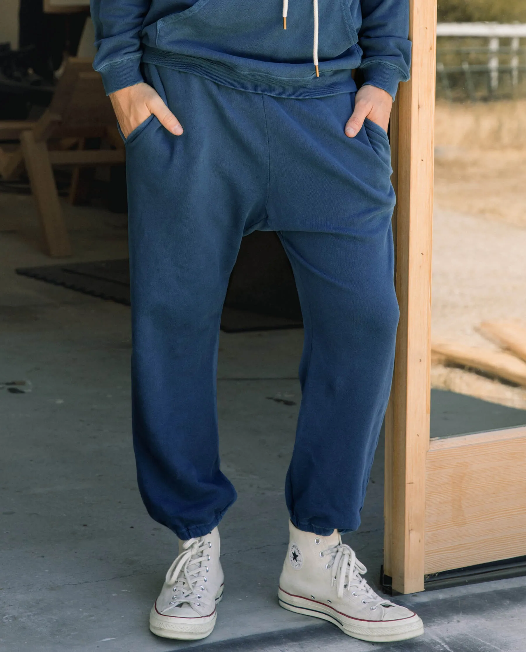The Men's Stadium Sweatpant. -- Dark Denim sold by THE GREAT.