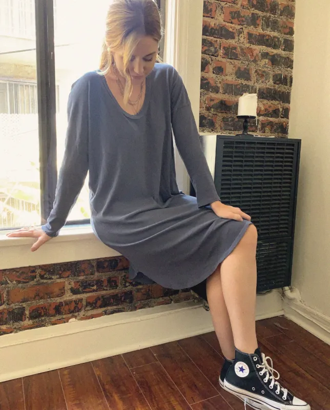 The U-Neck Dress. -- Navy sold by THE GREAT.