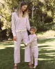 The Wide Leg Cropped Sweatpant. -- Washed White Colorful Stripe sold by THE GREAT.