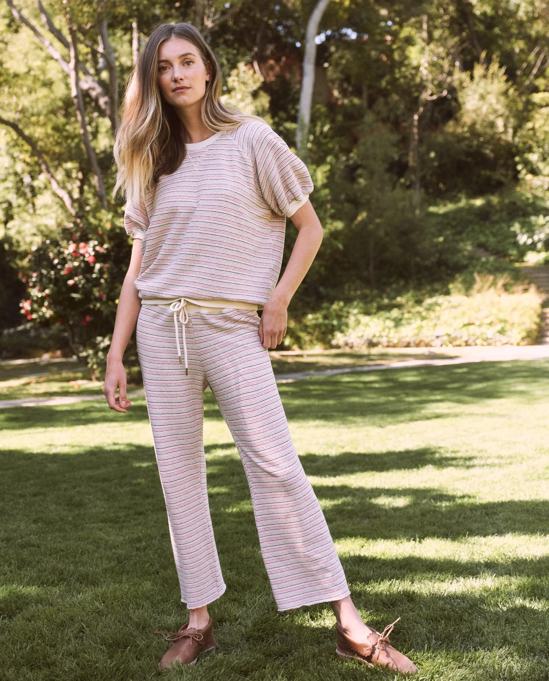 The Wide Leg Cropped Sweatpant. -- Washed White Colorful Stripe sold by THE GREAT.