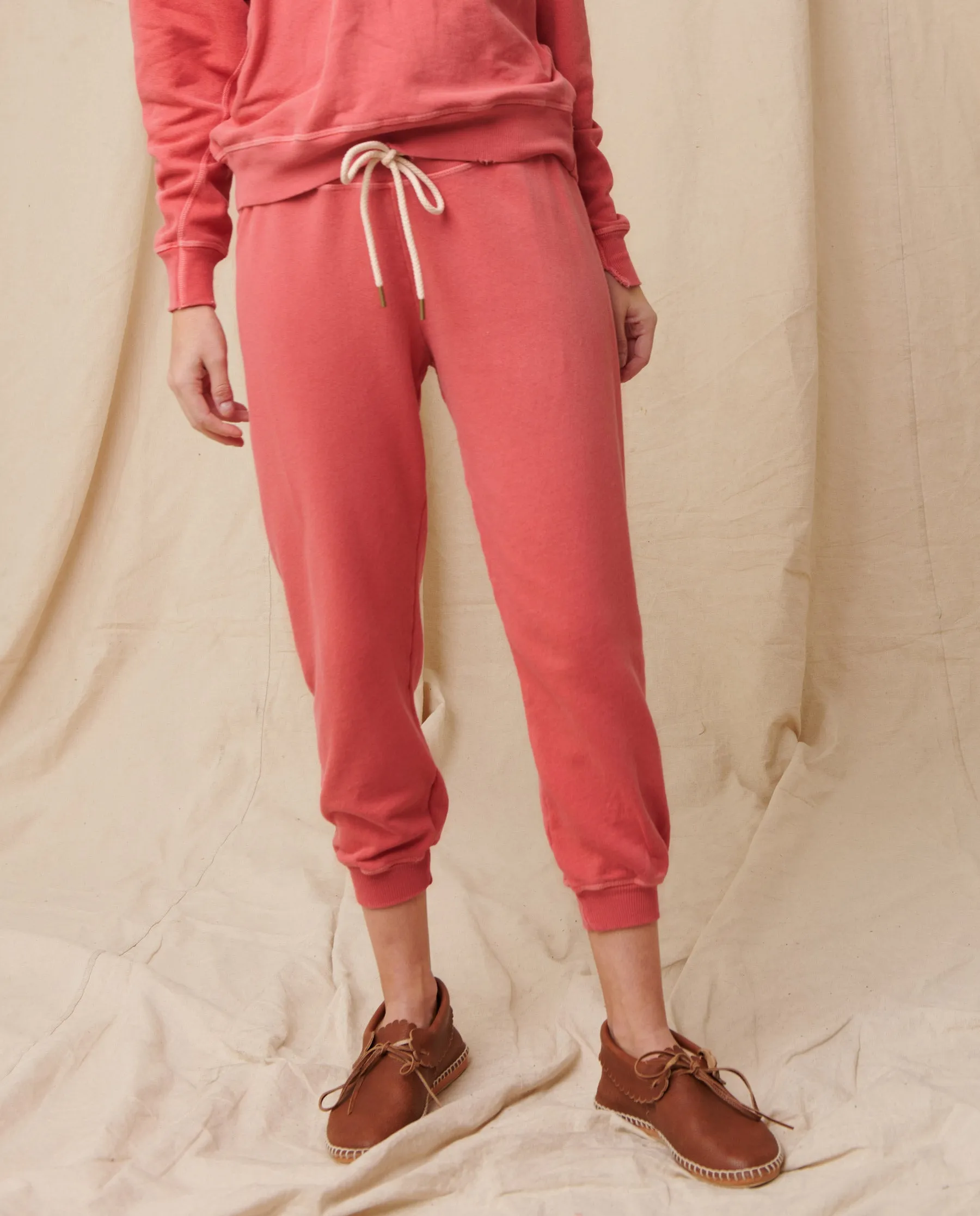 The Cropped Sweatpant. Solid -- Coral sold by THE GREAT.