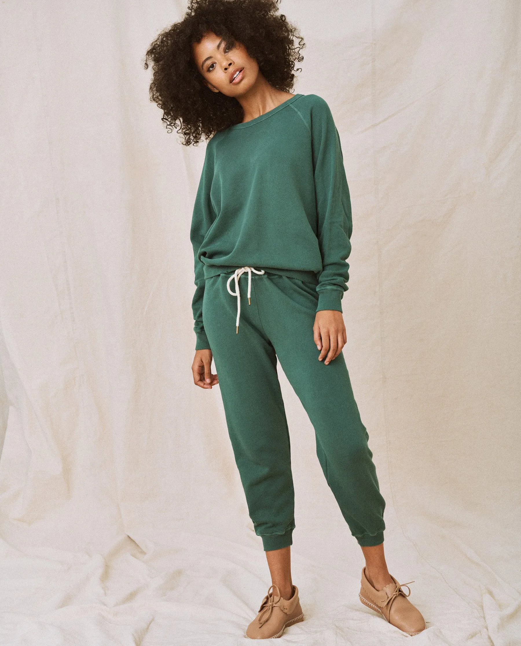 The Cropped Sweatpant. Solid -- Palm Leaf sold by THE GREAT.