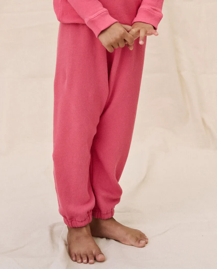 The Little Stadium Sweatpant. Solid -- Bright Rouge sold by THE GREAT.