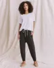 The Jersey Jogger Pant. -- Washed Black sold by THE GREAT.
