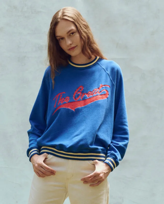 The Varsity College Sweatshirt. -- Cambridge Blue with Crest Graphic sold by THE GREAT.