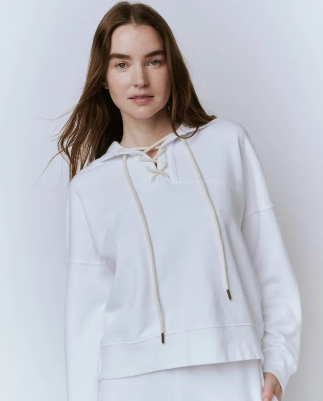 The Lace Up Hoodie. -- True White sold by THE GREAT.