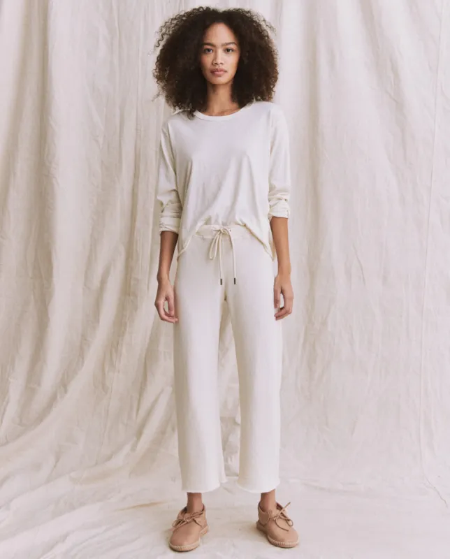 The Wide Leg Cropped Sweatpant. -- Washed White sold by THE GREAT.