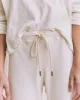 The Wide Leg Cropped Sweatpant. -- Washed White sold by THE GREAT.