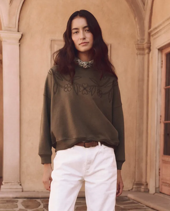 The Floral Applique Teammate Sweatshirt. -- Army sold by THE GREAT.