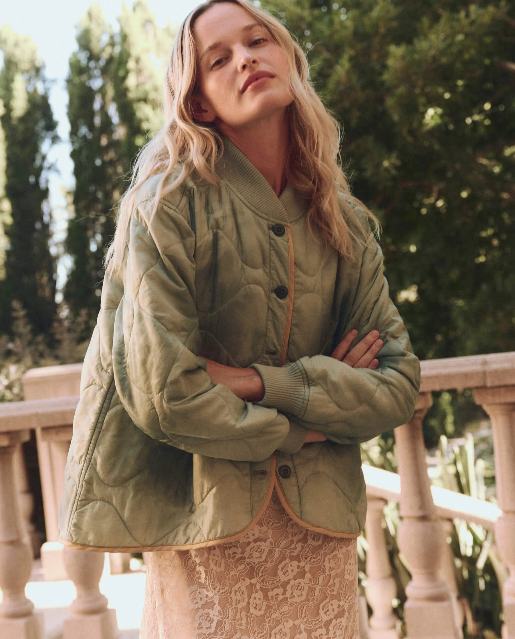 The Quilted Liner Jacket. -- Mottled Green sold by THE GREAT.
