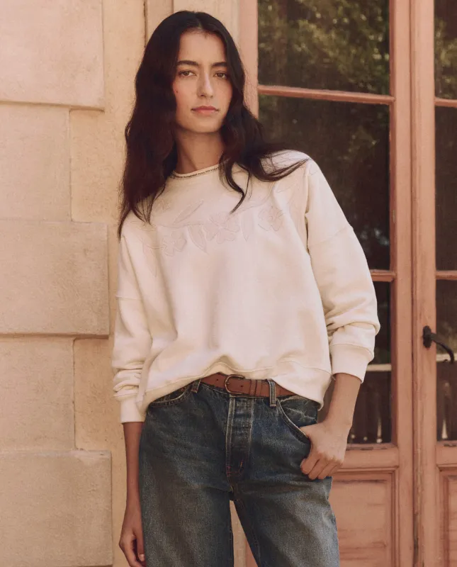 The Floral Applique Teammate Sweatshirt. -- Washed White sold by THE GREAT.