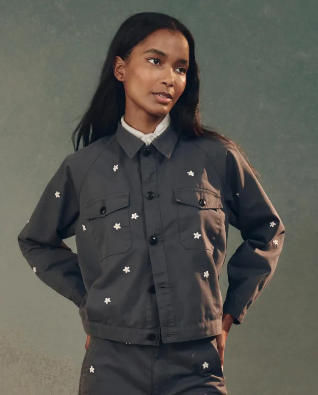 The Garage Jacket with Daisy Embroidery. -- Blue Slate sold by THE GREAT.