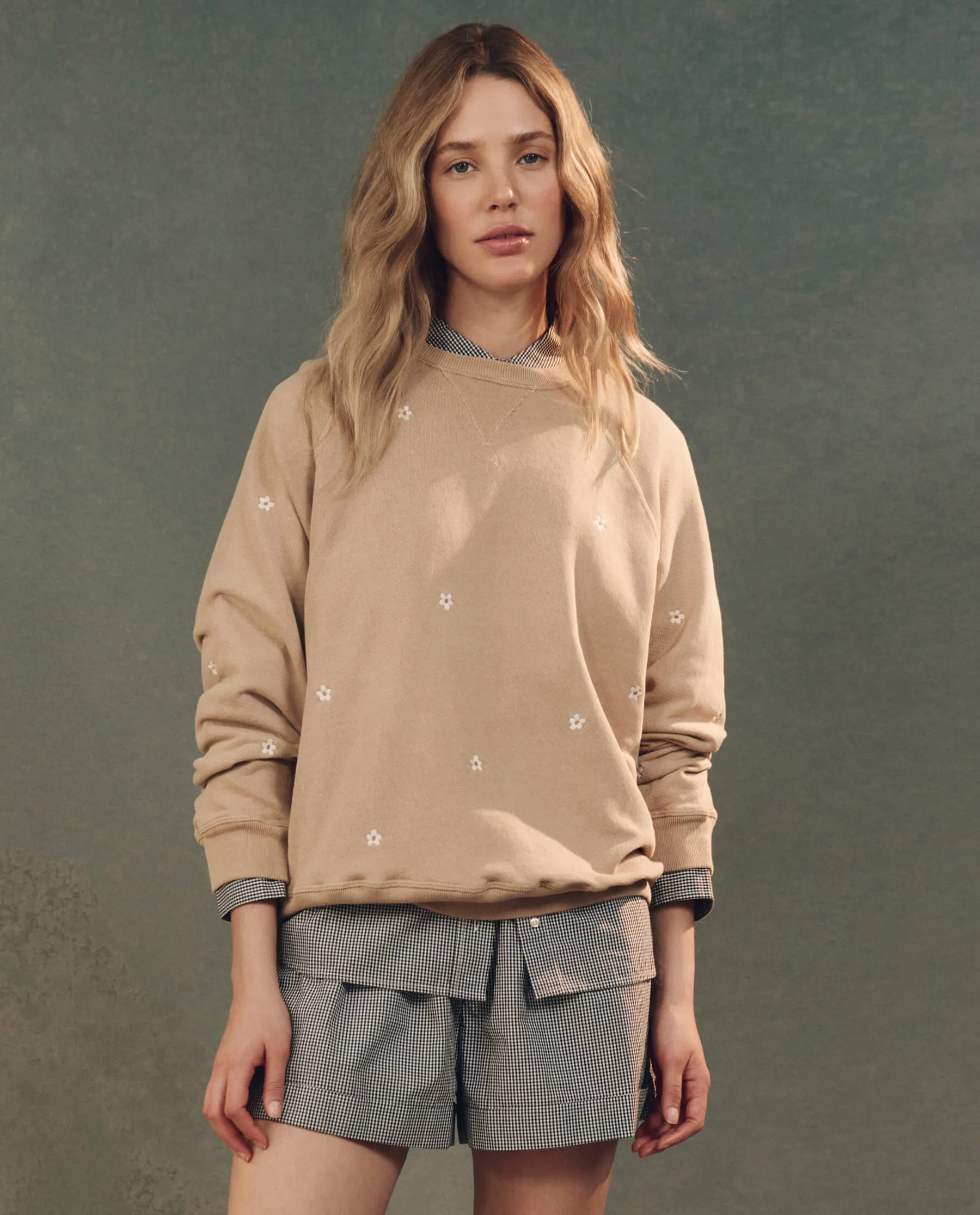 The Slouch Sweatshirt. Embroidered -- Khaki with Daisy Embroidery sold by THE GREAT.