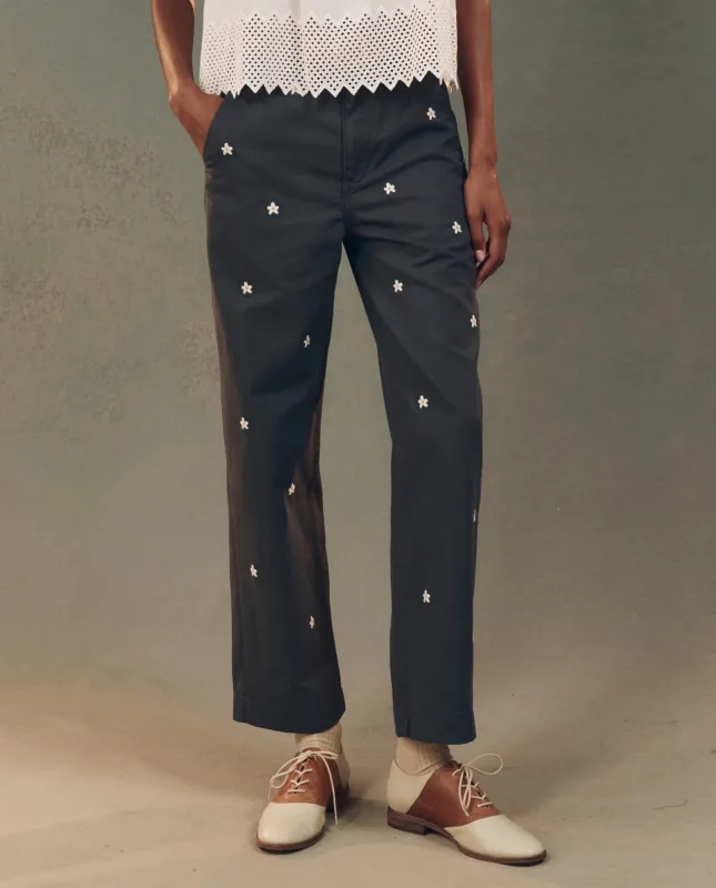 The Garage Pant with Daisy Embroidery. -- Blue Slate sold by THE GREAT.
