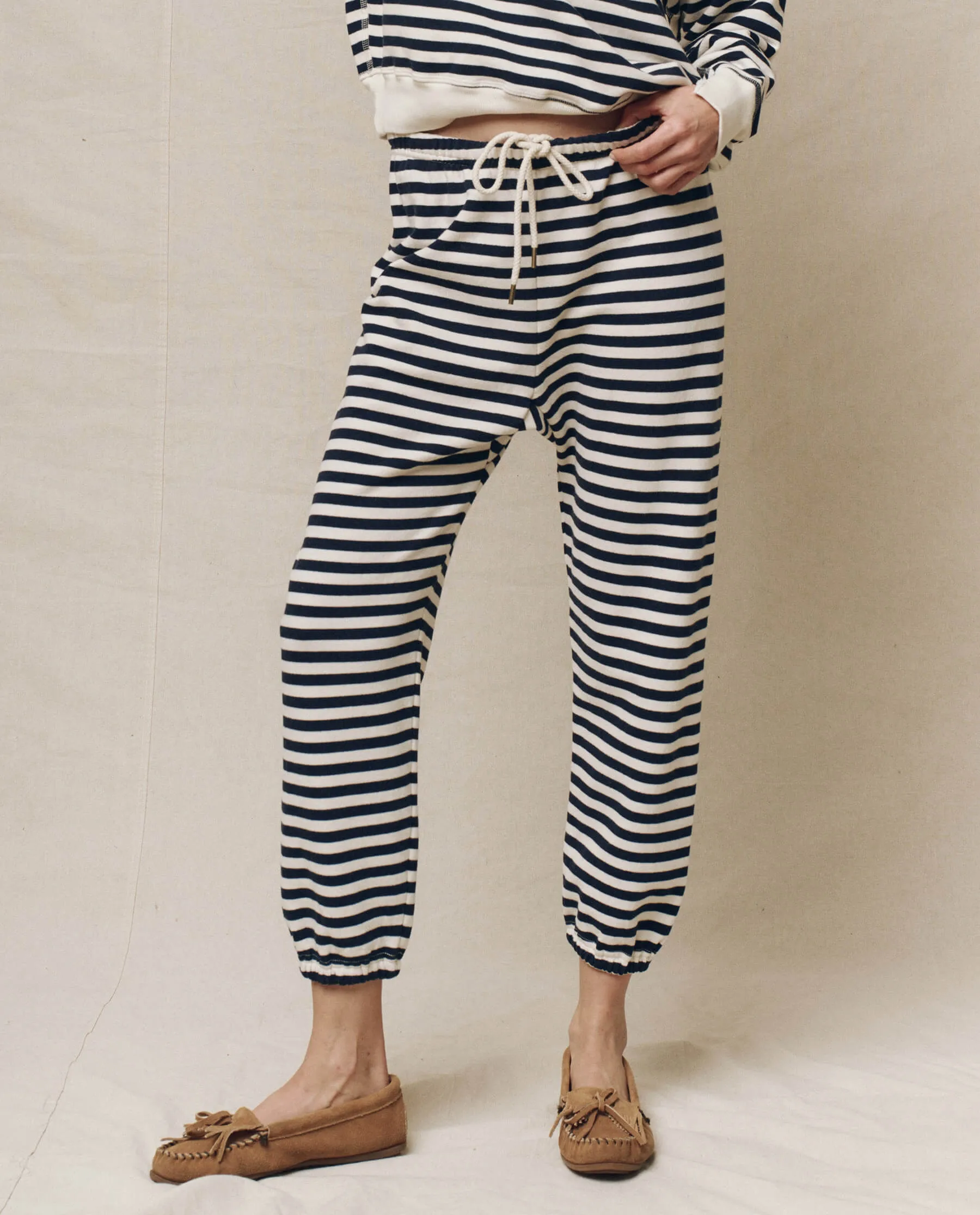The Stadium Sweatpant. Novelty -- Navy Sailor Stripe sold by THE GREAT.