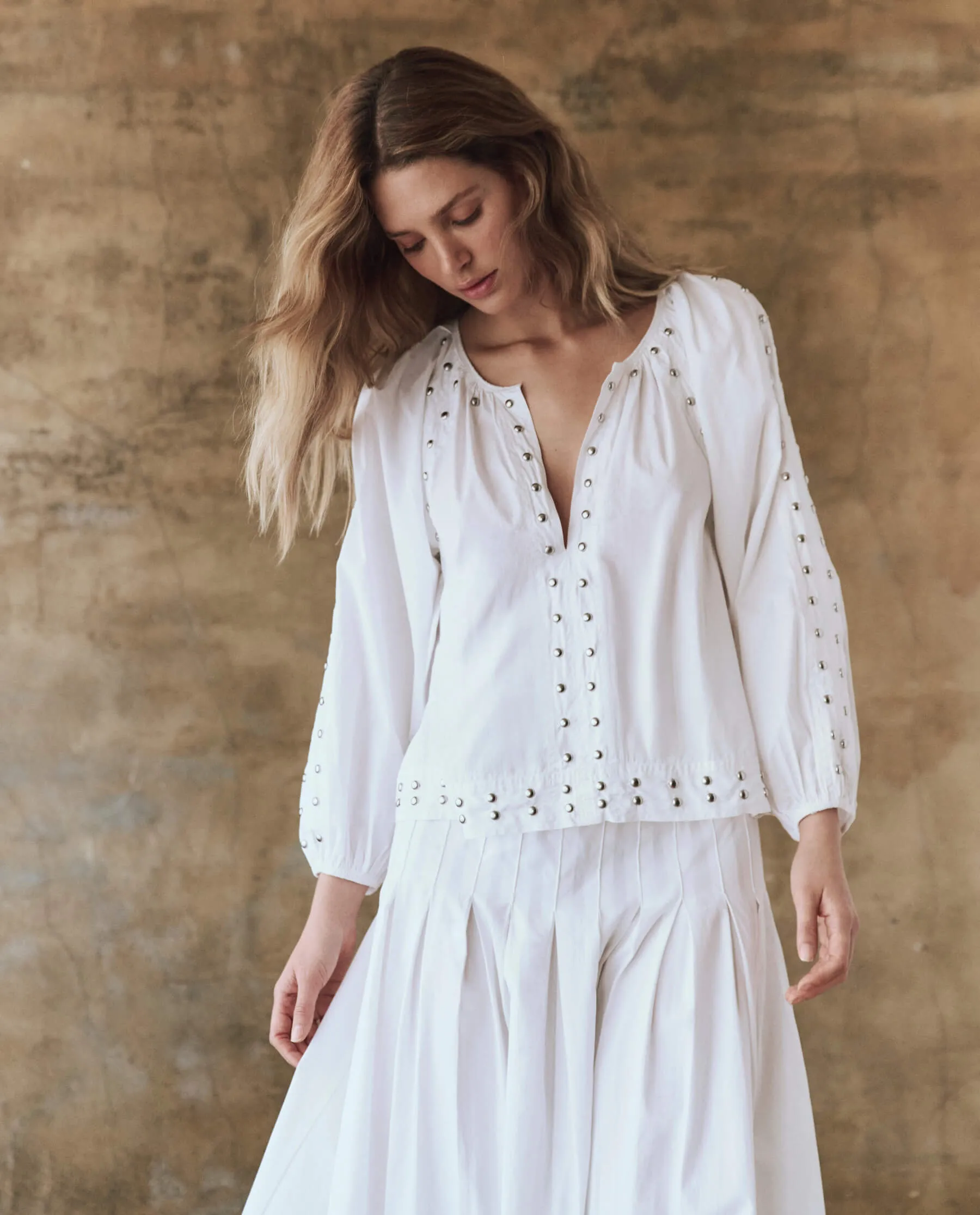 The Bodega Top with Studs. -- White sold by THE GREAT.