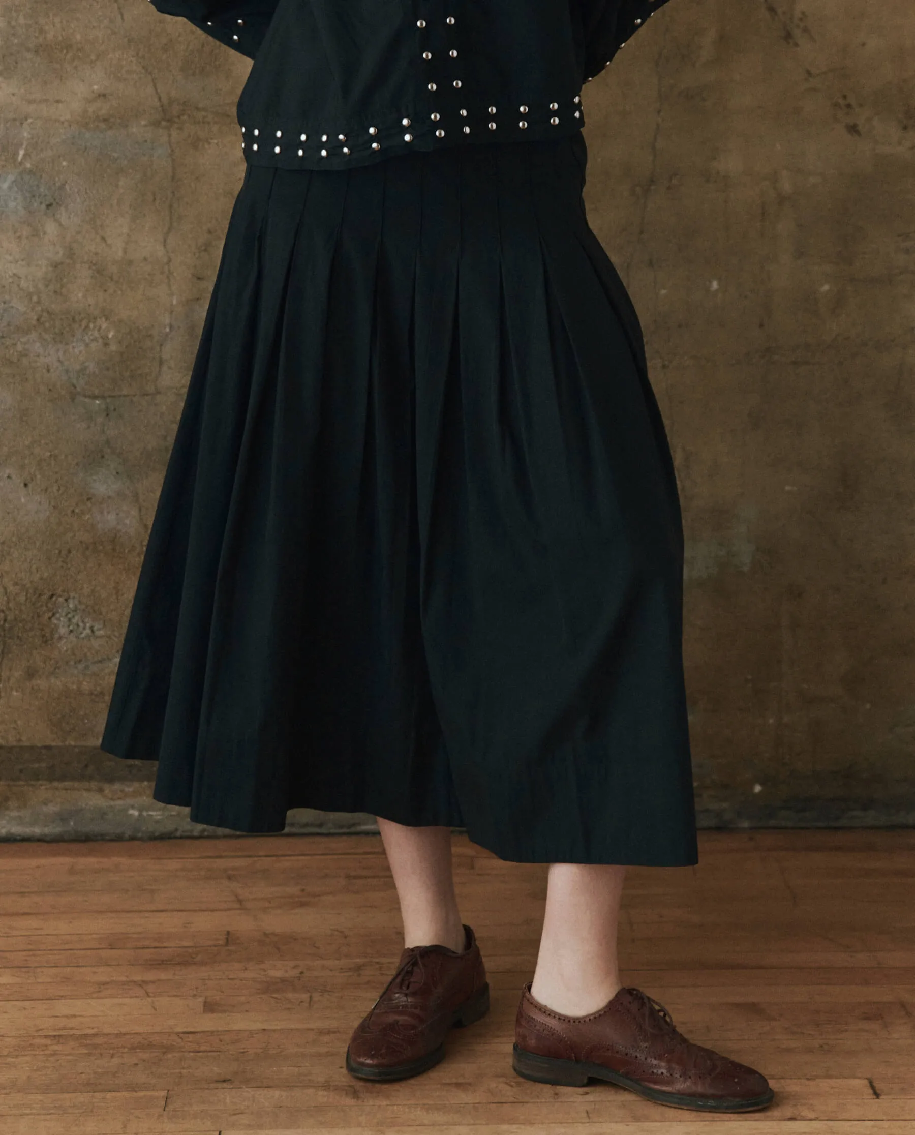 The Rhythm Skirt. -- Black sold by THE GREAT.