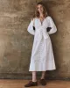 The Bodega Dress with Studs. -- White sold by THE GREAT.