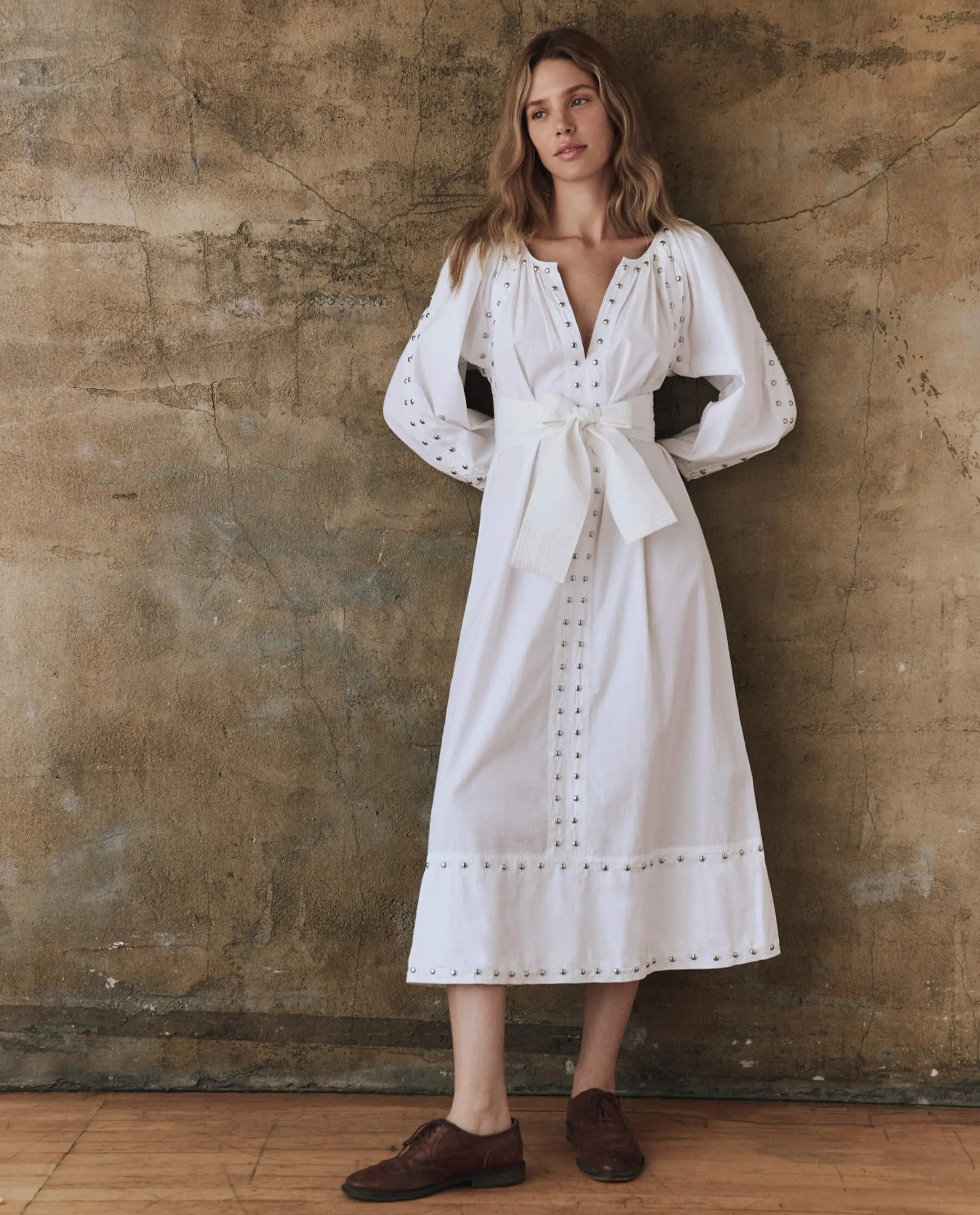 The Bodega Dress with Studs. -- White sold by THE GREAT.