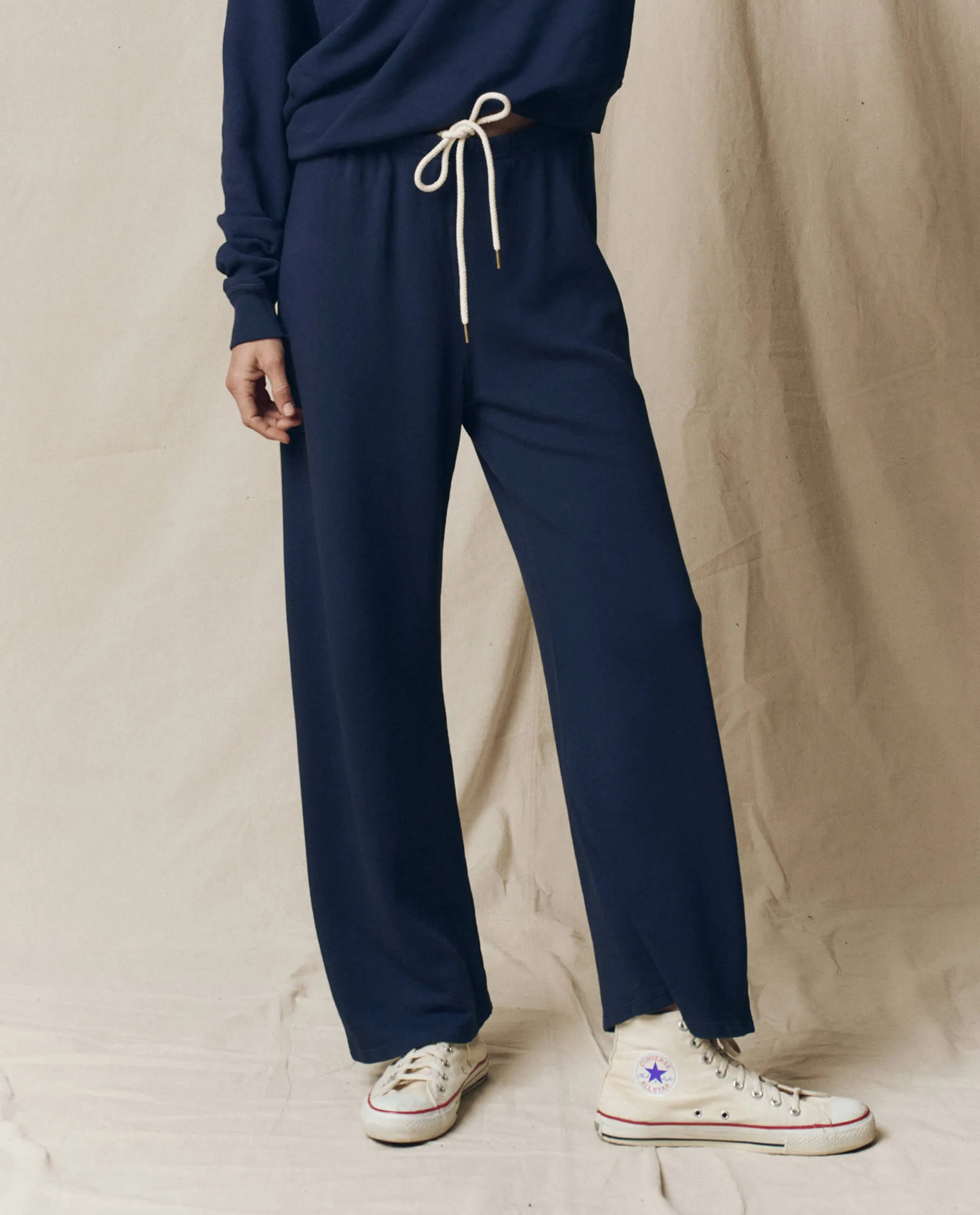 The Lap Sweatpant. Solid -- True Navy sold by THE GREAT.