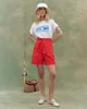 The Pleated Trouser Short. -- Hot Red sold by THE GREAT.
