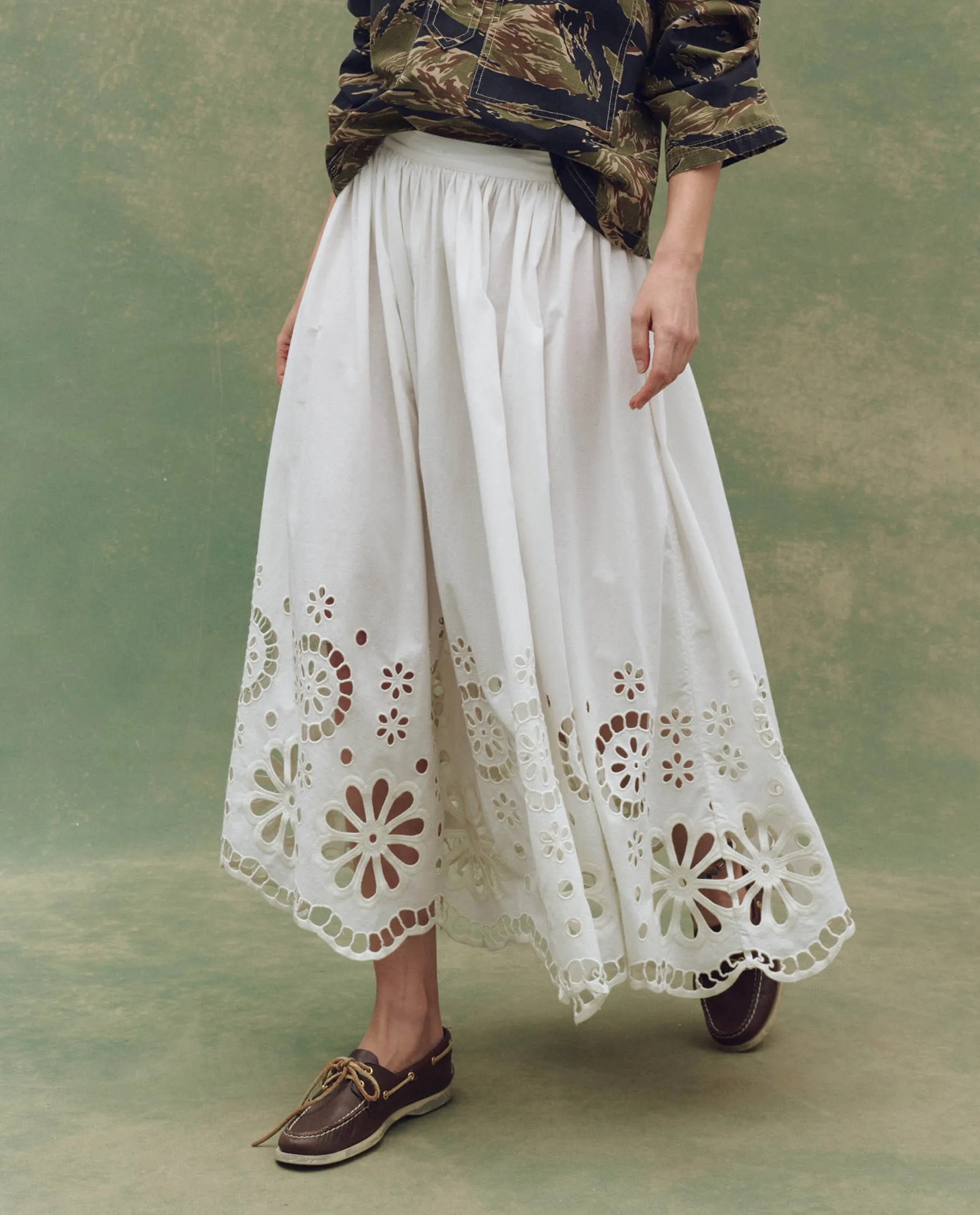 The Super Bloom Eyelet Skirt. -- White sold by THE GREAT.
