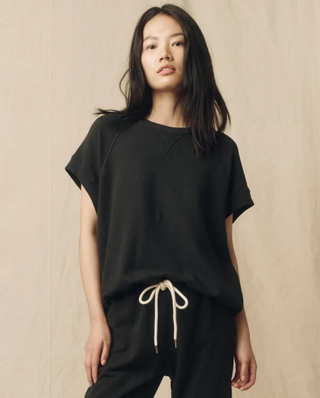 The Wedge Sweatshirt. -- Almost Black sold by THE GREAT.