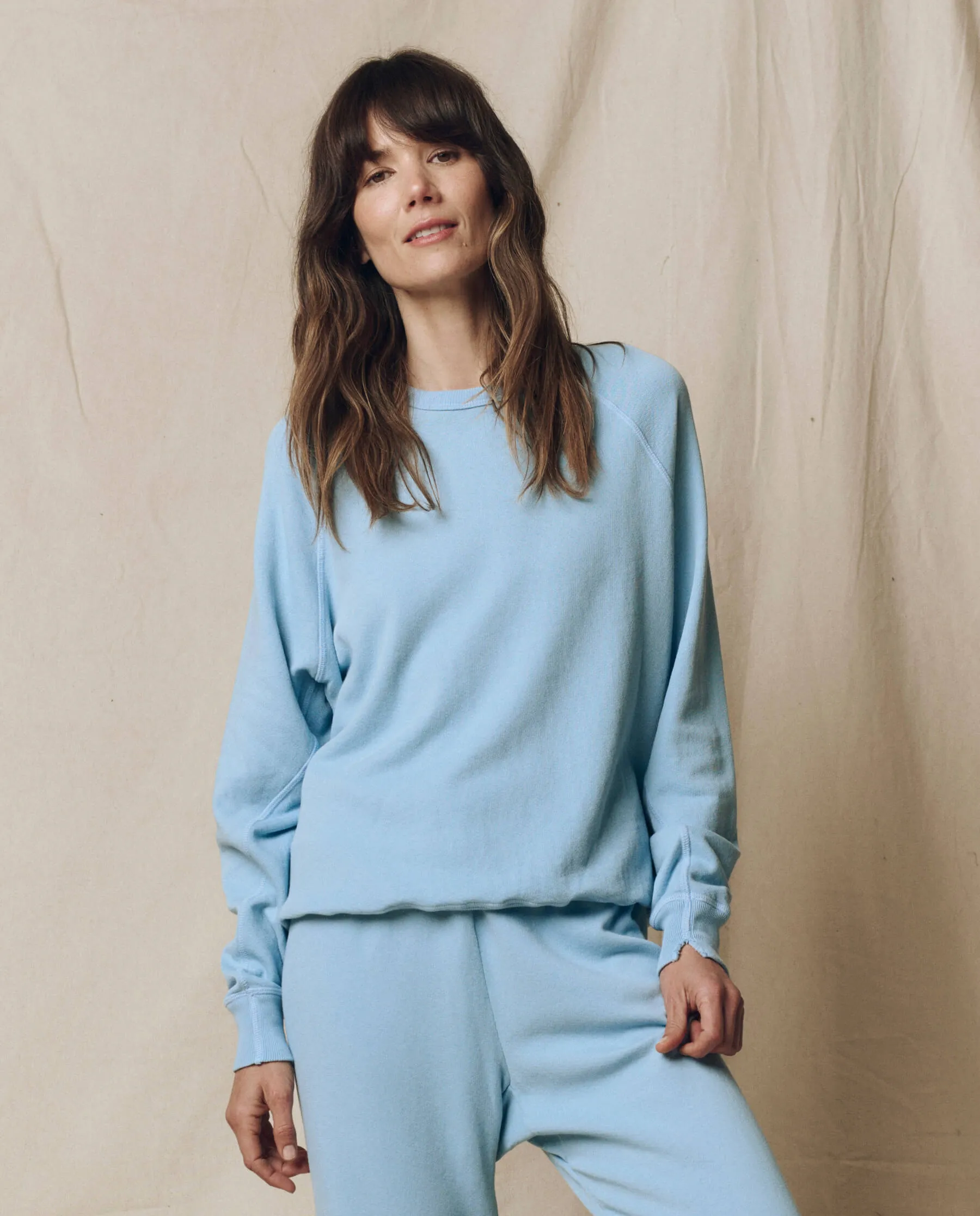 The College Sweatshirt. Solid -- Vista Blue sold by THE GREAT.