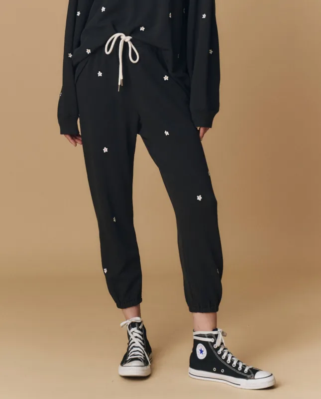 The Stadium Sweatpant. Embroidered -- Almost Black With Daisy Embroidery made by THE GREAT.