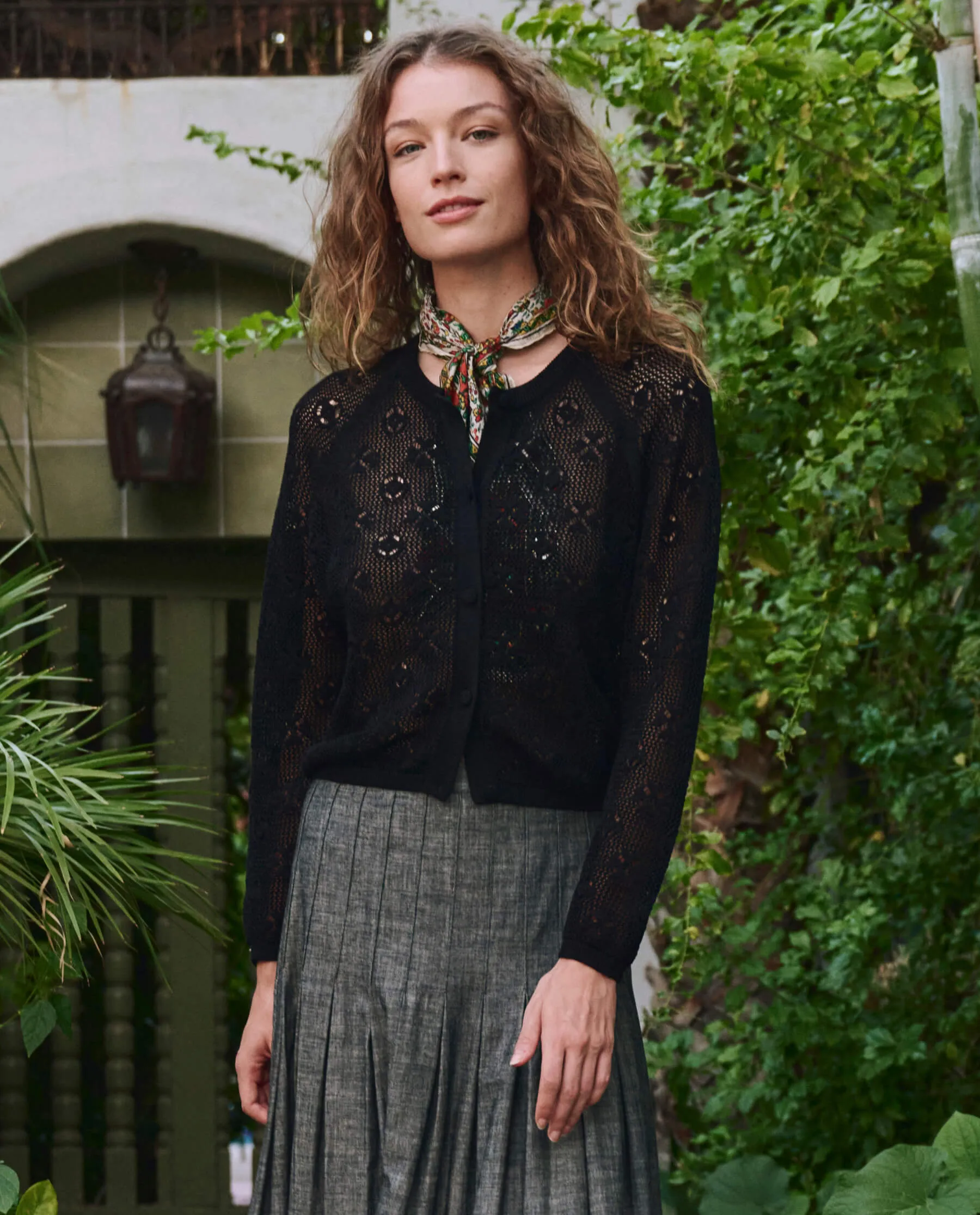 The Crochet Cardigan. -- Black sold by THE GREAT.