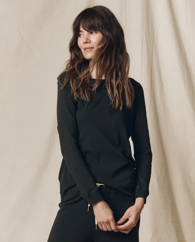 The Long Sleeve Slim Tee. Solid -- Almost Black sold by THE GREAT.