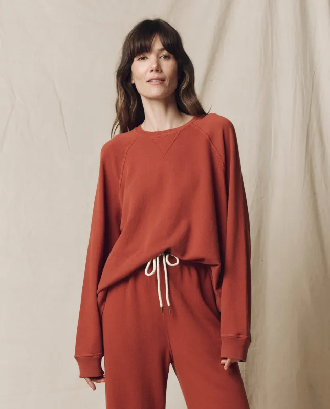 The Slouch Sweatshirt. Solid -- Brick sold by THE GREAT.