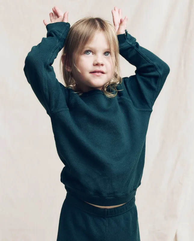 The Little College Sweatshirt. Solid -- Dark Slate sold by THE GREAT.