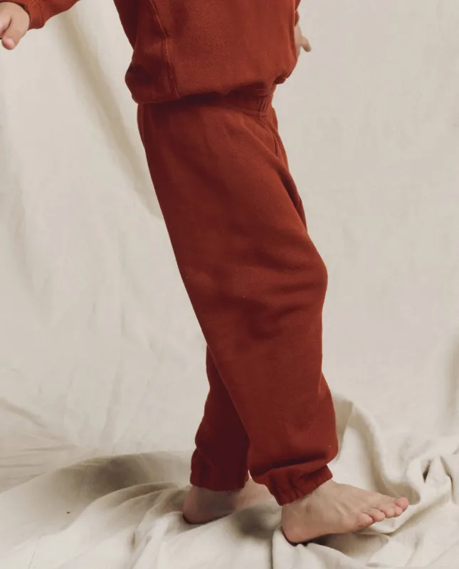 The Little Stadium Sweatpant. Solid -- Brick sold by THE GREAT.