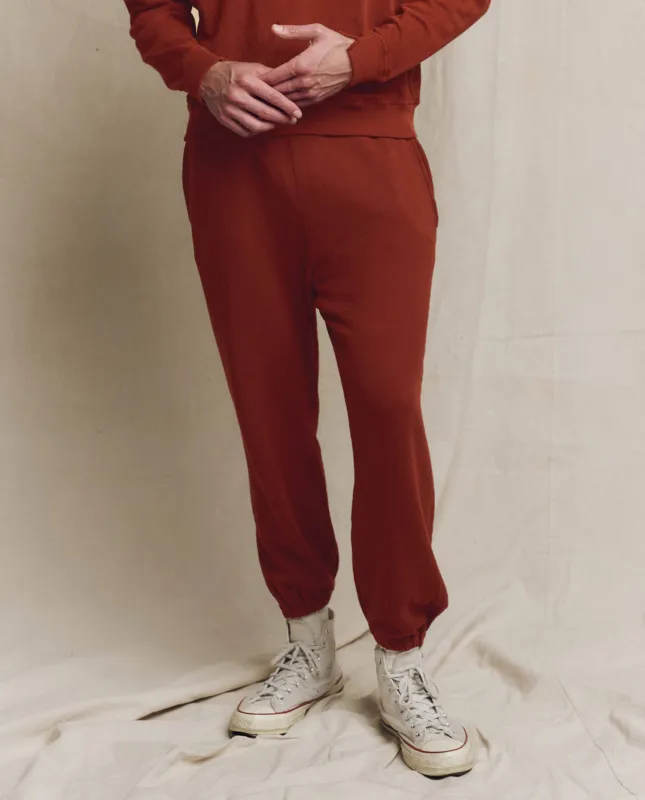 The Men's Stadium Sweatpant. Solid -- Brick sold by THE GREAT.