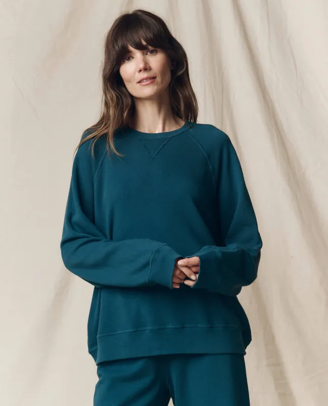 The Slouch Sweatshirt. Solid -- Dark Slate sold by THE GREAT.