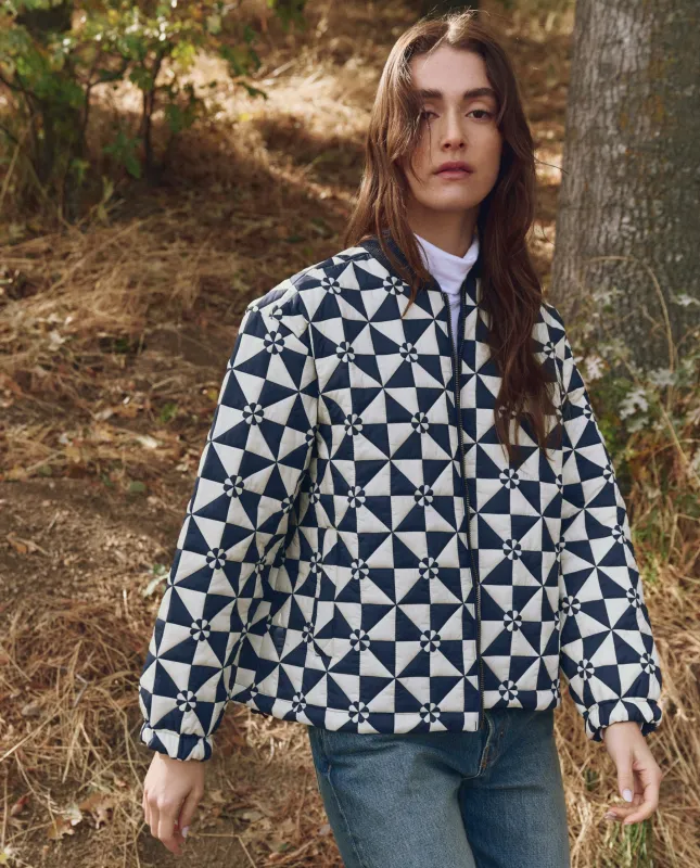 The Alps Puffer Jacket. -- Quilted Vintage Navy sold by THE GREAT.