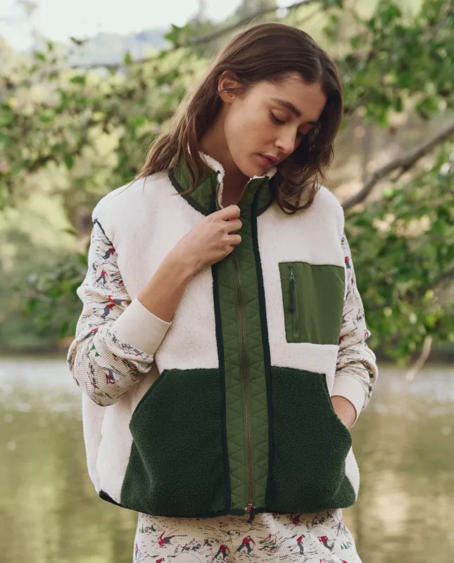The Plush Tundra Vest. -- Cream & Army sold by THE GREAT.
