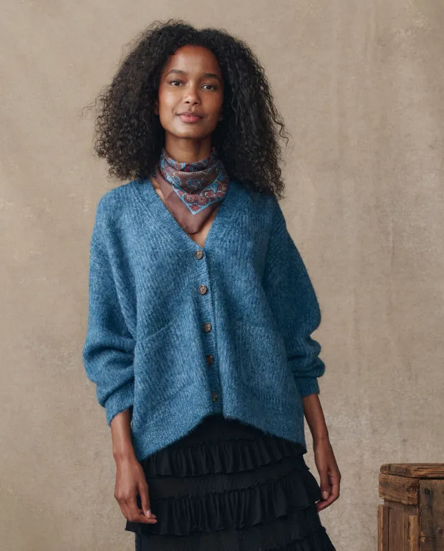 The Brushed Melange Cardigan. -- Wintertide Blue sold by THE GREAT.