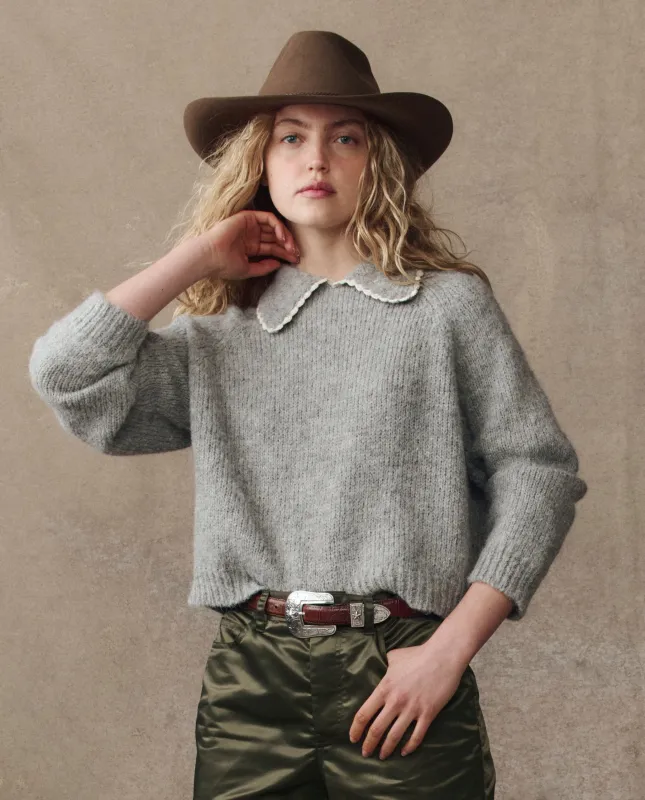 The Crochet Collar Pullover. -- Heather Grey sold by THE GREAT.