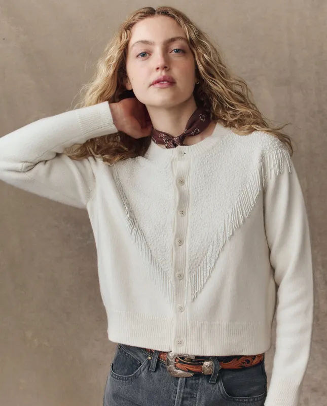 The Beaded Fringe Cardigan. -- Cream sold by THE GREAT.