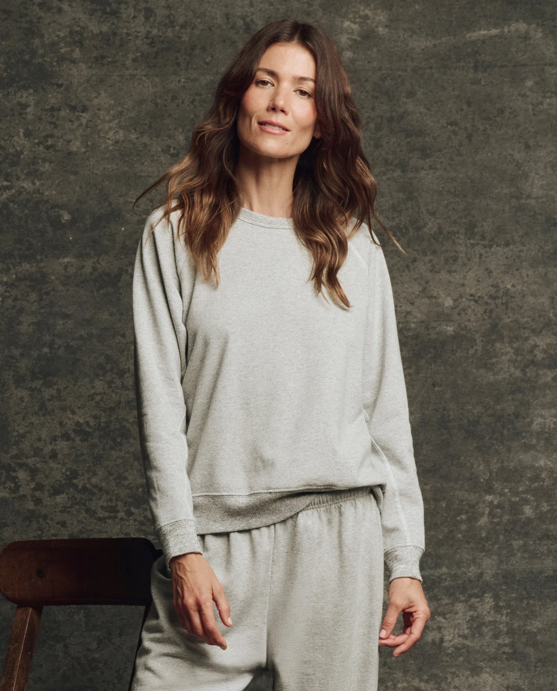 The Fleece Rookie Sweatshirt. Solid -- Heather Grey sold by THE GREAT.
