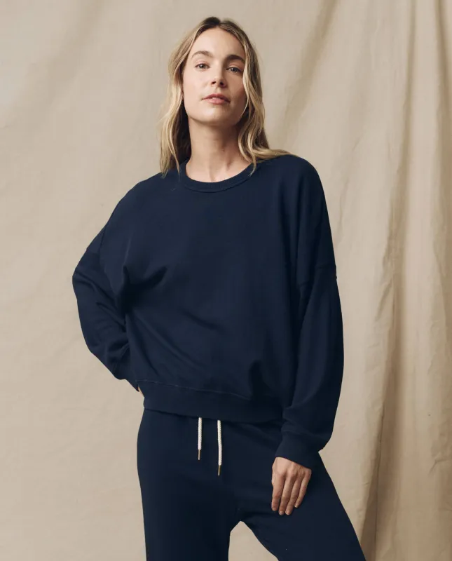 The Teammate Sweatshirt. Solid -- True Navy sold by THE GREAT.
