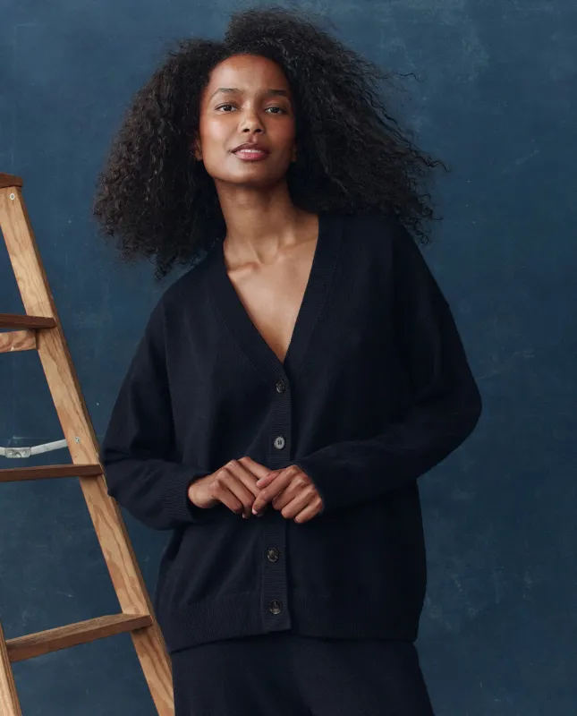 The Cashmere Slouch Cardigan. -- Navy sold by THE GREAT.