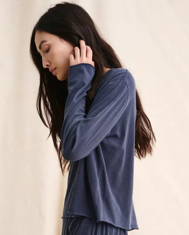 The Long Sleeve Crop Tee. -- Washed Navy sold by THE GREAT.